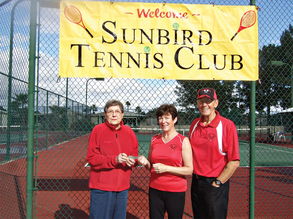 Pictured to the left is Jean Mrugala, President of the SunBird Garden Club, accepting a cash donation from the President and Vice President of the Tennis Club, Dave and Jen Walden. Jean was very excited to accept the contribution to use towards their future projects.