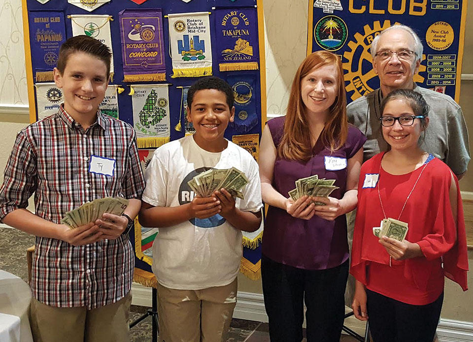 Pictured (left to right) are Ty Schmidt, Kade McIntyre, Katie Villaorduna (teacher) and Isa Mullen with Sun Lakes Rotary Club President Bill McCoach.