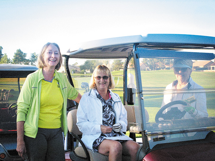Karen DeLong sends off golfers Darlene Google and Elaine Friesen. More than 50 Lady 18ers came out for opening day.