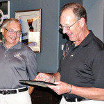 Dick Harrold (left) accepts the Volunteer of the Year award from Tennis Club President Rick Kenny.