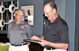 Dick Harrold (left) accepts the Volunteer of the Year award from Tennis Club President Rick Kenny.