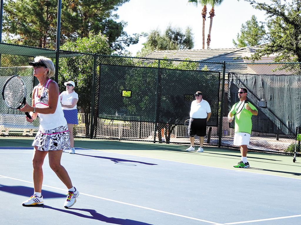 The IronOaks Tennis Club summer social included a clinic by Josh Bates and Gustavo Sanchez.