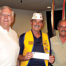 Lions Club members Garner and Sully with Commander Peer