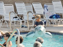 Mary Murphy riding the dolphin at the opening of the new swimming pool.