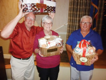 The January dance door prize winners from left to right are Tom Robinson, Sue Edwards and Don Hunt.