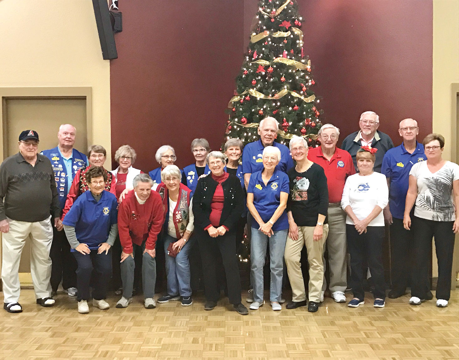 Members of the Chandler SunBird Lions Club celebrating Christmas with a potluck dinner and games.
