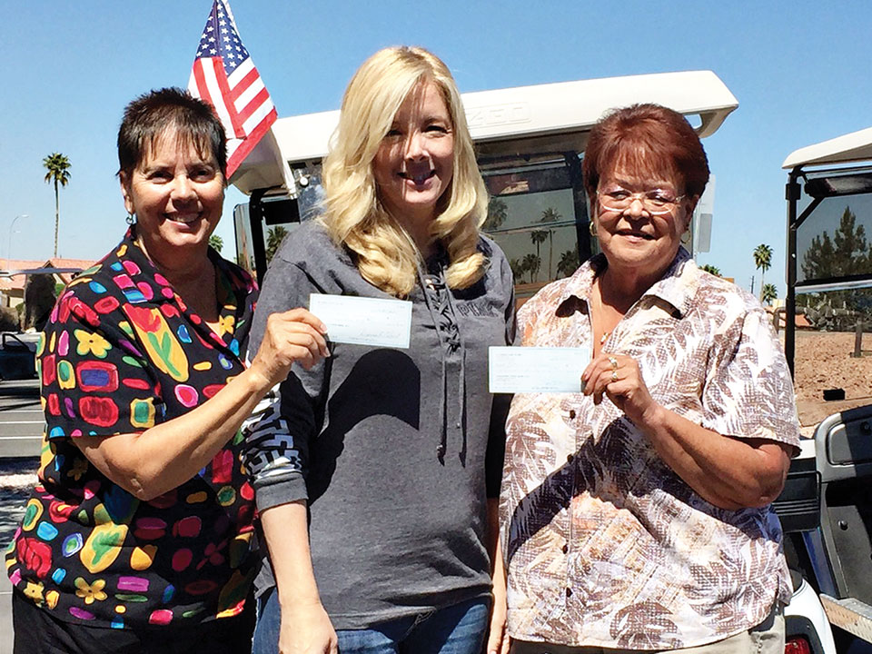 Linda Bengston, Jamie Sistek and Barb Dunbar delivering check to Boots in the House