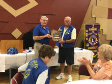 SunBird resident Gordon Olson is presented the Melvin Jones Fellow International Award by fellow Lion member Fred Garmeson. This award is given to a member for outstanding service to their community.