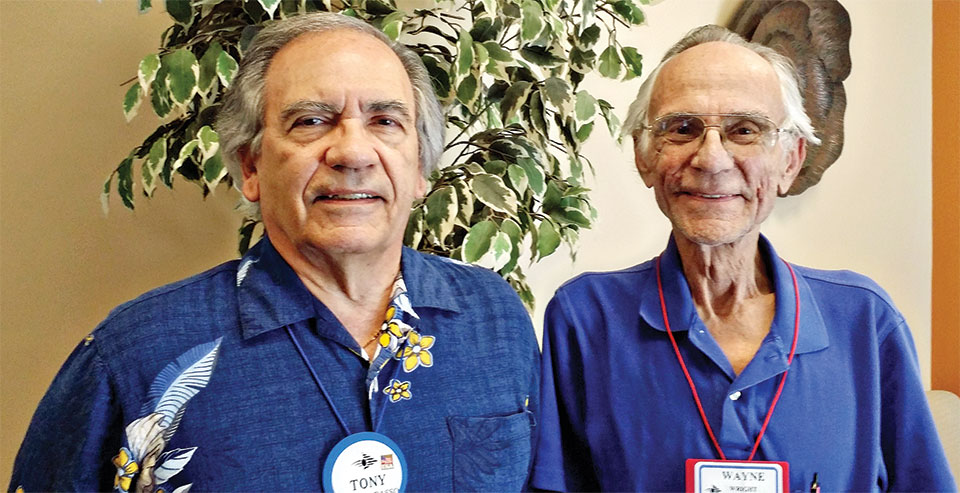 Tony Contrabasso (left) and Wayne Wright (right) share information about the Speakers Bureau for New Adventures in Learning.