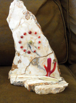 This clock was cut from globe onyx collected by club members with accents created using the fused glass technique.