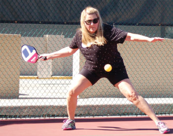 Darlene Dolich hits a return during the championship match.