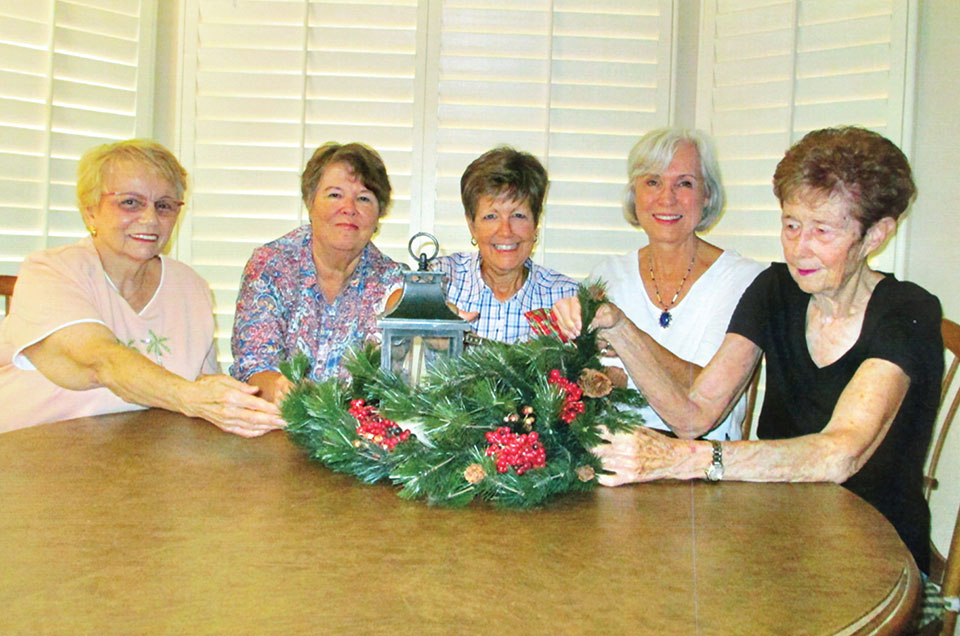 EN members Carol Barnes, Jackie Hutchins, Barbara Mattes, Bonnie Savard and Marcy Petrek finalizing table decorations.