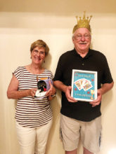 Pictured are Dog House Loser Jackie Morgan and Crowned King Neil Donohoe for the Aug. 6 euchre party.