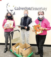 Left to right: School Principal Annette Addair, Ellie Watland, and Judi Edmonds (Photo taken at Galveston Elementary School)